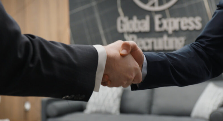 Legal guidance for requirements to enter the US shown by a business handshake